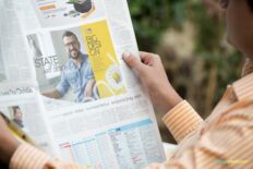 Newspaper Mockup – Hands Holding Paper