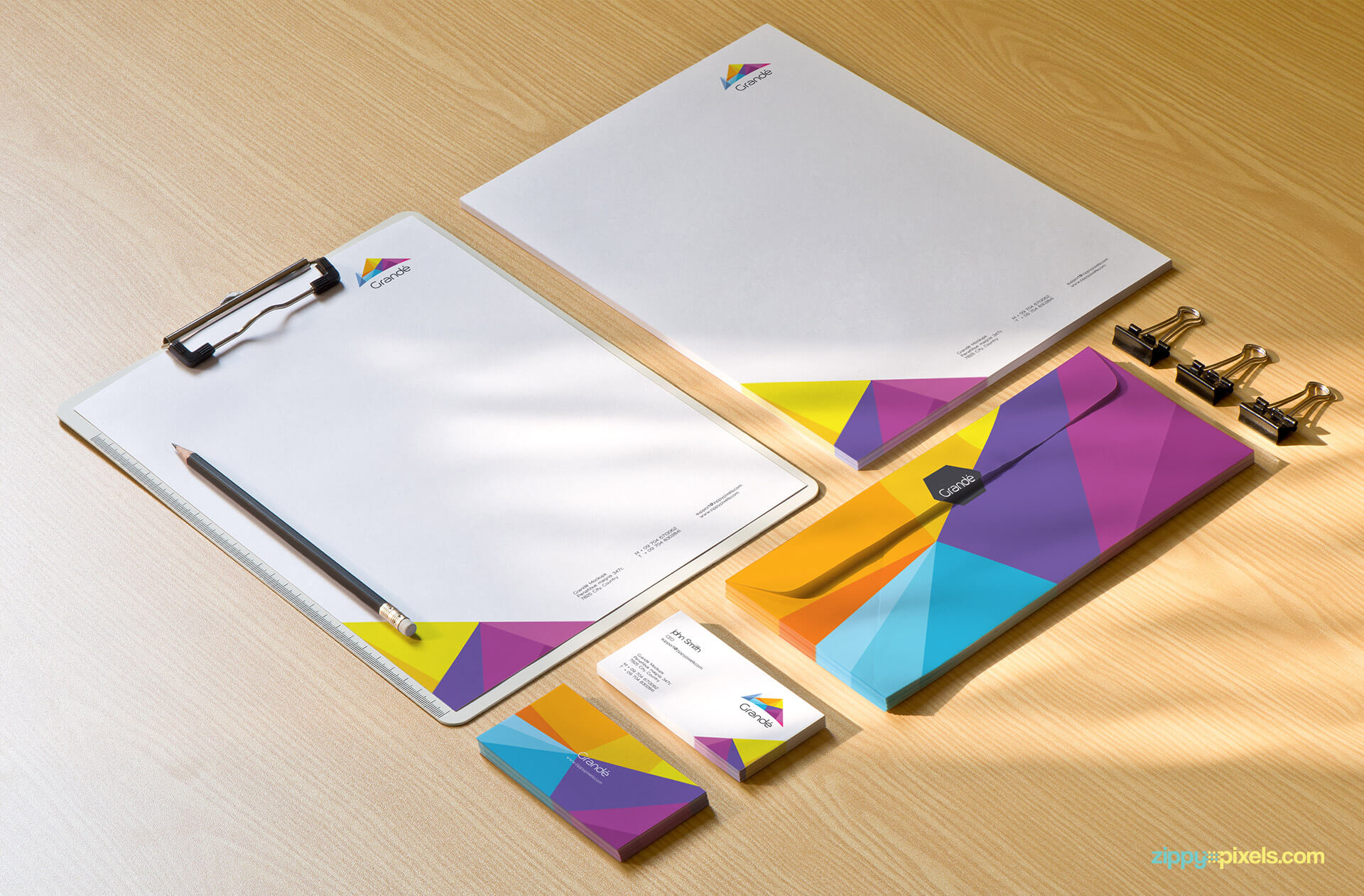 Corporate Identity Mockup of clipboard, letterhead, business cards, pencil and clips.