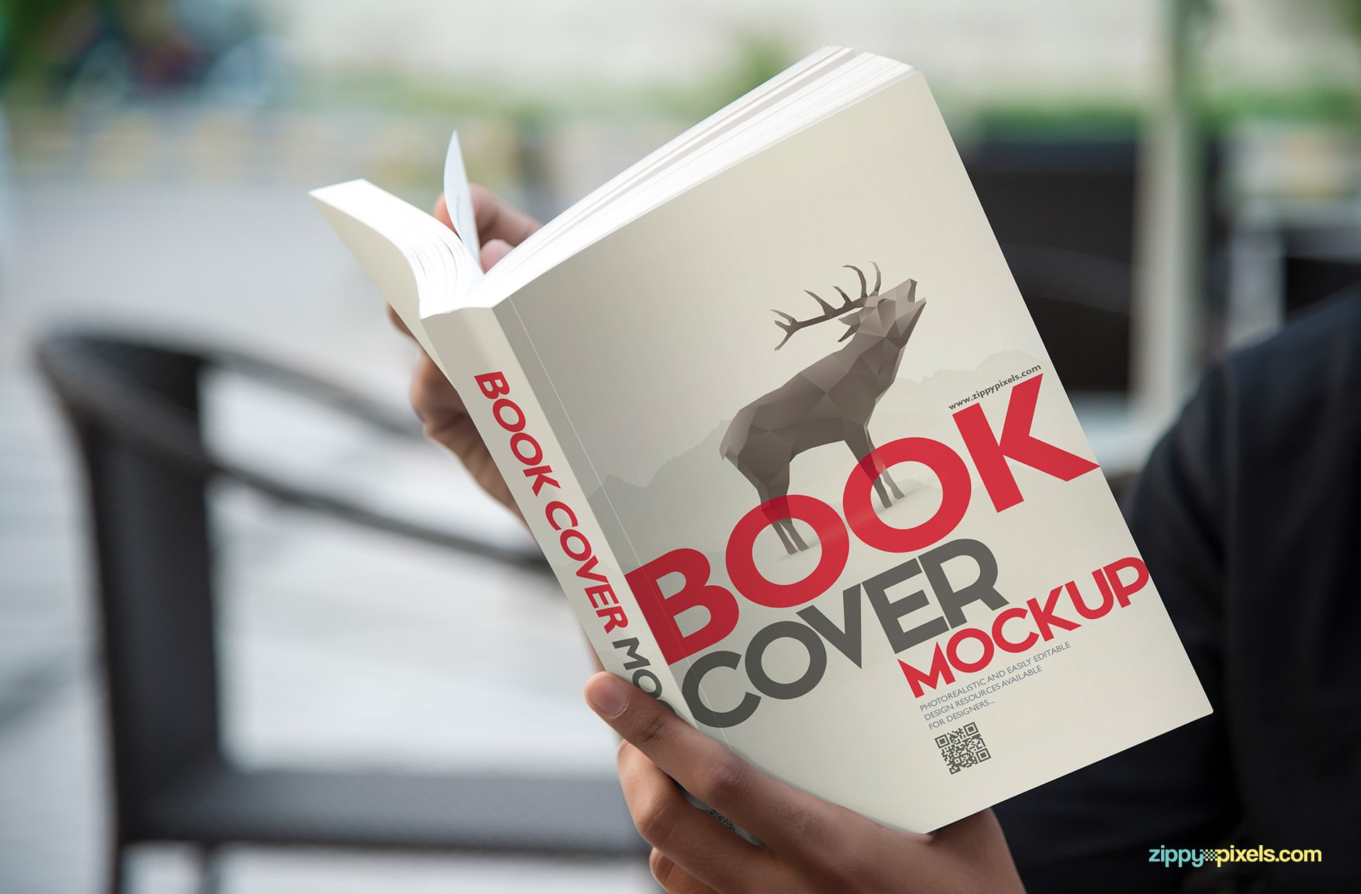 Book cover mockup - person holding paperback book in hands for showcasing cover design