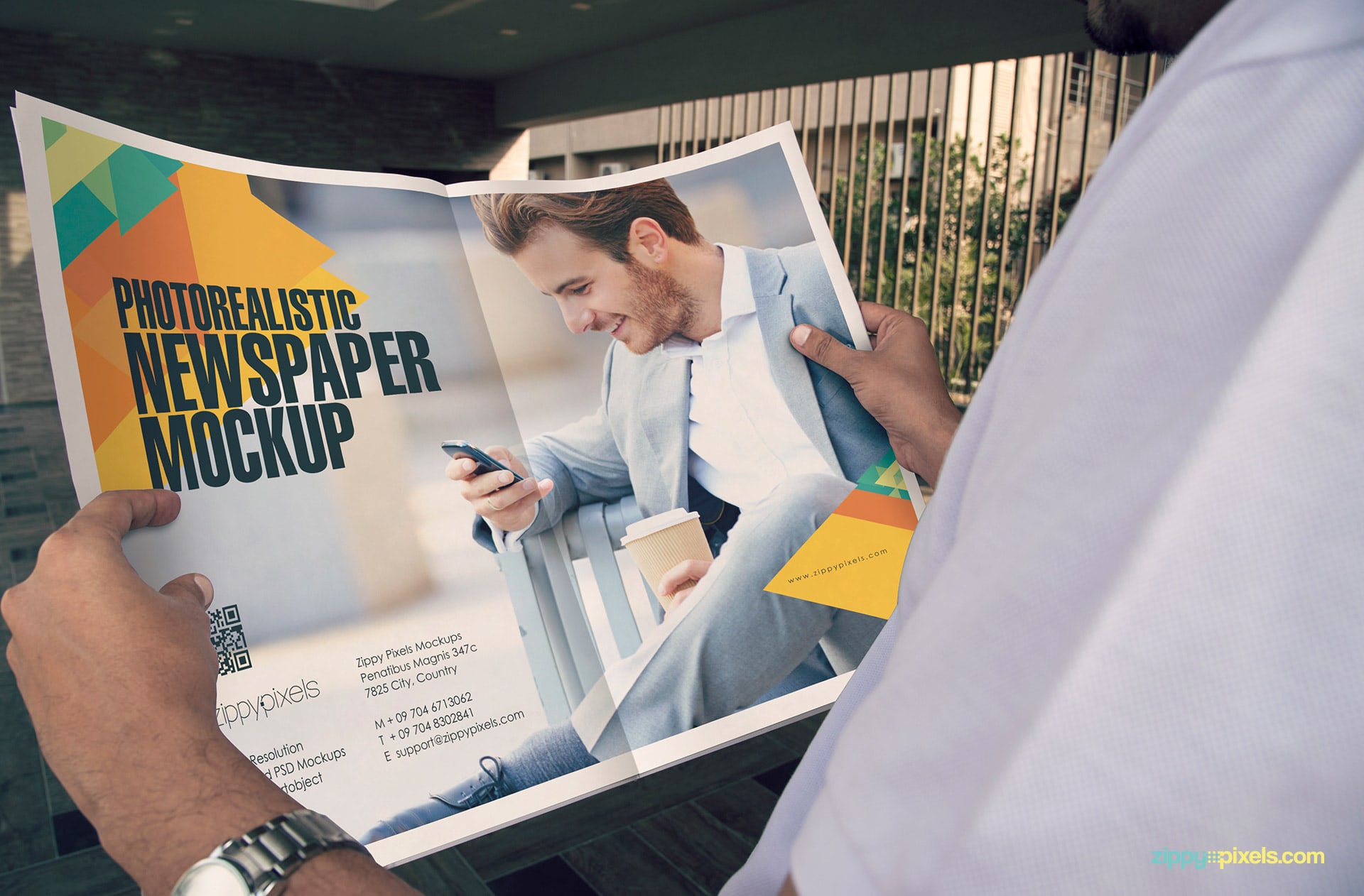 newspaper ad mockup showing person holding newspaper in hands showing 2 page double truck ad