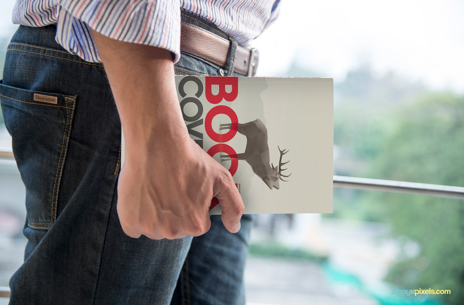 Soft cover book mockup showcasing a person carrying paperback book