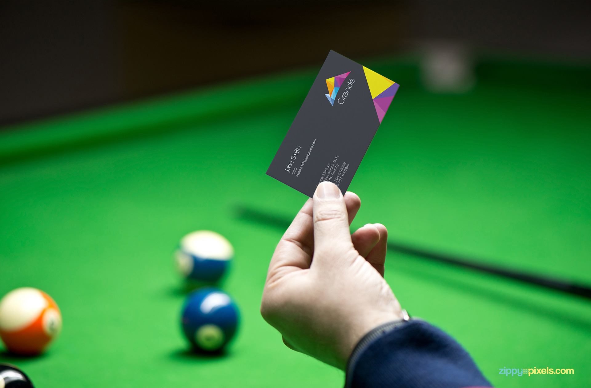 Free and easy to use realistic business card mockup with a pool table background.