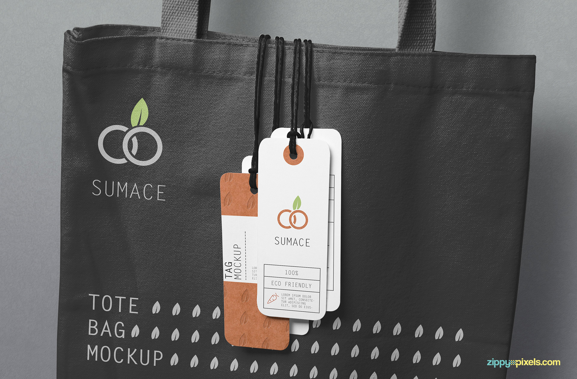 4 tags hanging on a customizable tote bag.