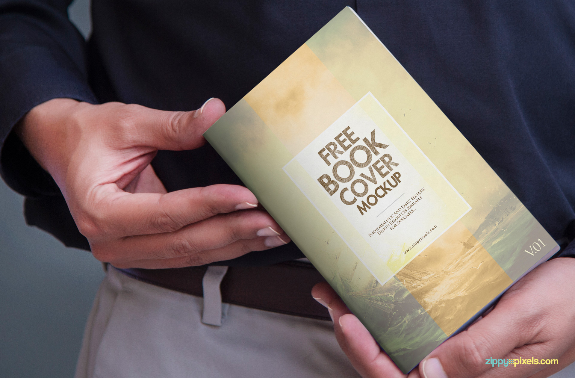 A man holding book design mockup in hands.