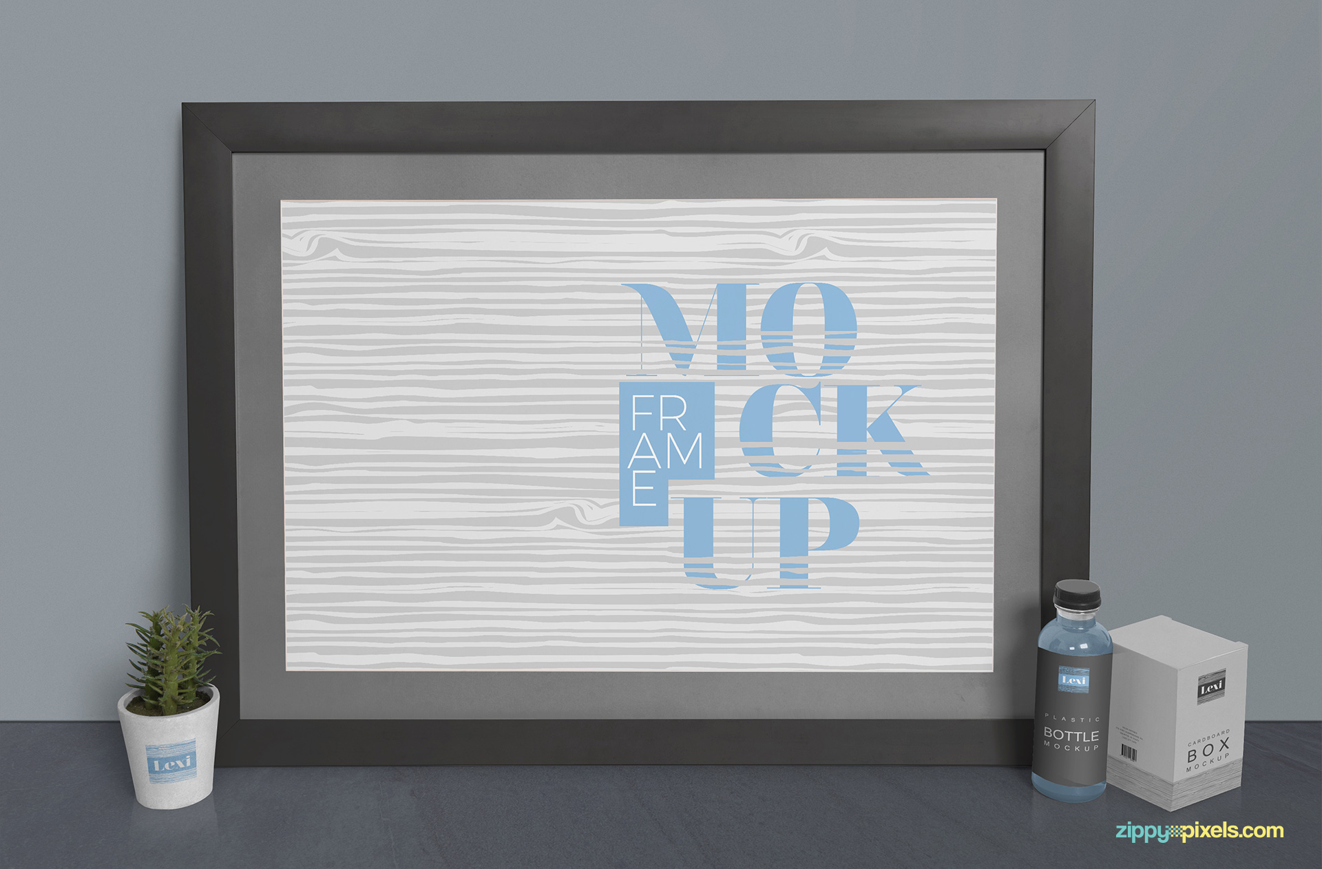 Photo frame mockup scene including frame, plant pot, bottle and packaging box.